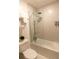 Clean bathroom with a glass-enclosed shower, modern fixtures, and a sleek toilet at 5245 W Irlo Bronson Memorial Hwy # 148, Kissimmee, FL 34746