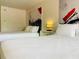 Bright bedroom featuring two beds, modern art, and a nightstand with a lamp at 5245 W Irlo Bronson Memorial Hwy # 148, Kissimmee, FL 34746