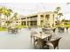 Enjoy outdoor seating and community amenities with views of the exterior of the condos at 5245 W Irlo Bronson Memorial Hwy # 148, Kissimmee, FL 34746