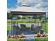 Exterior gazebo offers a designated smoking area with comfortable seating amidst lush greenery at 5245 W Irlo Bronson Memorial Hwy # 148, Kissimmee, FL 34746