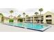 Outdoor pool offers a refreshing experience with ample lounge seating and palm tree views at 5245 W Irlo Bronson Memorial Hwy # 148, Kissimmee, FL 34746