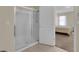 Bathroom features a glass-enclosed shower and tile flooring at 561 Lake Cummings Way, Lake Alfred, FL 33850