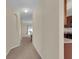 Inviting hallway leading to living spaces, showcasing open floor plan design at 561 Lake Cummings Way, Lake Alfred, FL 33850