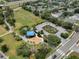 Overhead view of a community park with playground, parking, and green spaces at 5768 Los Palma Vista Dr, Orlando, FL 32837