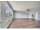Spacious bedroom featuring a ceiling fan, and a large window for ample natural light at 5768 Los Palma Vista Dr, Orlando, FL 32837