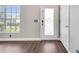 Entryway with a window to the outside and wood-look floors at 5768 Los Palma Vista Dr, Orlando, FL 32837