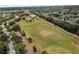 Aerial view showcasing a well-maintained athletic field in a park-like community at 5768 Los Palma Vista Dr, Orlando, FL 32837