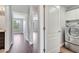 Hallway with laundry room and views of other rooms at 5768 Los Palma Vista Dr, Orlando, FL 32837