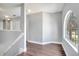 Upper hallway with wood floors and natural light from an arched window at 5768 Los Palma Vista Dr, Orlando, FL 32837