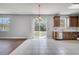 Open kitchen with stainless appliances, decorative tile backsplash, and sliding glass doors to the backyard at 5768 Los Palma Vista Dr, Orlando, FL 32837