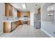 Updated kitchen with stainless steel appliances, mosaic backsplash, and tile flooring at 5768 Los Palma Vista Dr, Orlando, FL 32837