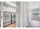Laundry room with washer and dryer, featuring ample storage space at 5768 Los Palma Vista Dr, Orlando, FL 32837