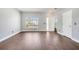 Spacious living room with wood floors and a large window for natural light at 5768 Los Palma Vista Dr, Orlando, FL 32837