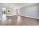 Open-concept living space with archways and wood-look floors at 5768 Los Palma Vista Dr, Orlando, FL 32837