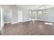 Open-concept living space with archways and wood-look floors at 5768 Los Palma Vista Dr, Orlando, FL 32837