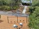 An aerial view shows a playground with swings and benches in a wooded, park-like setting at 5768 Los Palma Vista Dr, Orlando, FL 32837