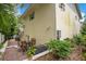 Back exterior showcasing the brick-paved patio and lush greenery, creating a private outdoor oasis at 606 N Mcdonald St, Mount Dora, FL 32757