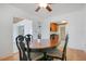 Traditional dining room with hardwood floors adjacent to the kitchen at 606 N Mcdonald St, Mount Dora, FL 32757