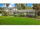 Well-maintained front yard with lush landscaping and a charming exterior, offering a warm welcome at 606 N Mcdonald St, Mount Dora, FL 32757