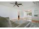 Spacious living room with hardwood floors and abundant natural light at 606 N Mcdonald St, Mount Dora, FL 32757