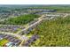 Scenic aerial view of the community, showcasing its proximity to a lake and conservation areas at 6080 Fender Ct, Orlando, FL 32837