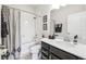 Bathroom featuring vanity with black cabinets, shower with curtain, and decor at 6080 Fender Ct, Orlando, FL 32837