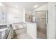 Bathroom featuring tub, shower, neutral tile, and an inspirational wall decal at 6080 Fender Ct, Orlando, FL 32837