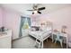 bedroom has a white bunk bed, fan, and a desk area at 6080 Fender Ct, Orlando, FL 32837