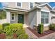 Charming entryway with a green front door, brick pathway and well-maintained landscaping at 6080 Fender Ct, Orlando, FL 32837
