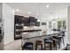 Bright kitchen features a large island with seating and stainless steel appliances at 6080 Fender Ct, Orlando, FL 32837