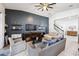 Cozy living room features dark wood paneling and comfortable seating at 6080 Fender Ct, Orlando, FL 32837