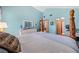 Spacious primary bedroom with a view of a bathroom, beautiful light and hardwood floors at 6464 Timberwind Pl, Orlando, FL 32818