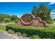 Autumn Chase community sign features brickwork, lush greenery, and clear lettering under a sunny sky at 6464 Timberwind Pl, Orlando, FL 32818