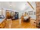 Inviting dining room featuring wooden floors, natural light, and adjacent foyer at 6464 Timberwind Pl, Orlando, FL 32818