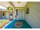 Welcoming front porch with decorative accents and lush landscaping at 6464 Timberwind Pl, Orlando, FL 32818