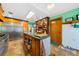 Charming kitchen with custom cabinets, stainless steel appliances, and a large center island at 6464 Timberwind Pl, Orlando, FL 32818