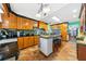 Spacious kitchen with an island, granite countertops, and custom cabinetry at 6464 Timberwind Pl, Orlando, FL 32818