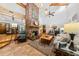 Spacious living room with exposed beams, brick fireplace, and ample natural light at 6464 Timberwind Pl, Orlando, FL 32818