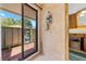 Tiled shower with glass door to outside patio, featuring a clear view of the back yard at 6464 Timberwind Pl, Orlando, FL 32818