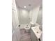 Modern bathroom featuring a white tile shower and updated vanity at 709 28Th Nw St, Winter Haven, FL 33881