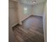 Bright bedroom featuring wood-look floors and a window for natural light at 709 28Th Nw St, Winter Haven, FL 33881