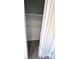 Walk-in closet with shelf and wood-look floors at 709 28Th Nw St, Winter Haven, FL 33881