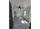 An interior living room view with new floors and ceiling fan at 709 28Th Nw St, Winter Haven, FL 33881