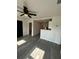 Interior living room view showcasing new flooring and access to the kitchen at 709 28Th Nw St, Winter Haven, FL 33881