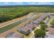 A beautiful aerial view shows homes with screened-in pools and a scenic pond at 8571 La Isla Dr, Kissimmee, FL 34747
