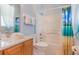 Bright bathroom featuring a shower-tub combination and light wood vanity at 8571 La Isla Dr, Kissimmee, FL 34747