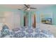 This bedroom has a ceiling fan, closet, dresser with mirror, and TV at 8571 La Isla Dr, Kissimmee, FL 34747