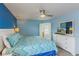 Relaxing bedroom with king bed, dresser with TV and ensuite bathroom at 8571 La Isla Dr, Kissimmee, FL 34747