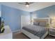 Cozy bedroom with a double closet and natural lighting, offering a relaxing retreat at 8571 La Isla Dr, Kissimmee, FL 34747
