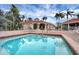 Inviting community pool and spa area, perfect for relaxation and leisure, surrounded by well-maintained brick patios at 8571 La Isla Dr, Kissimmee, FL 34747